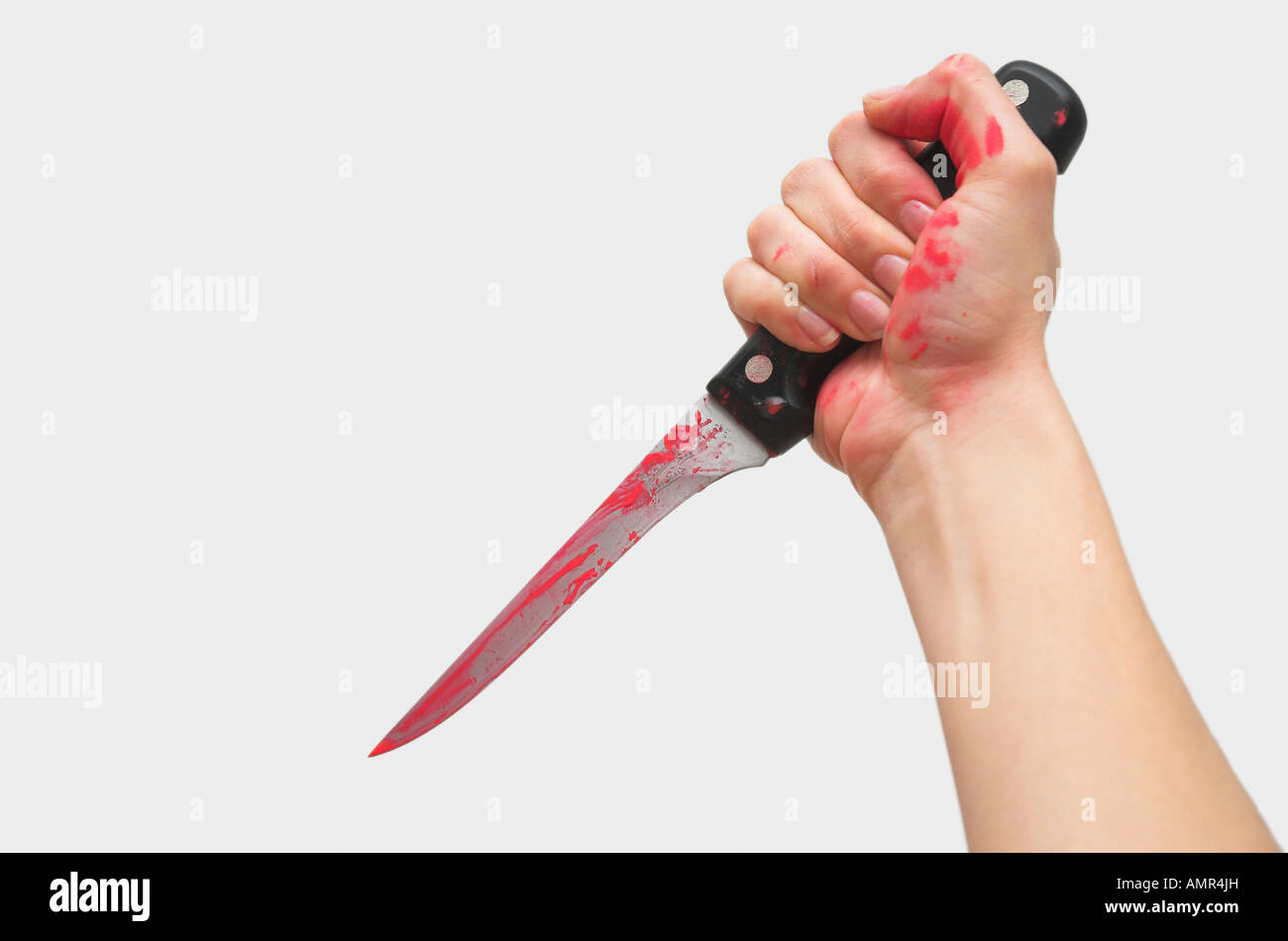 La main de femme avec de la peinture rouge holding knife Banque D'Images