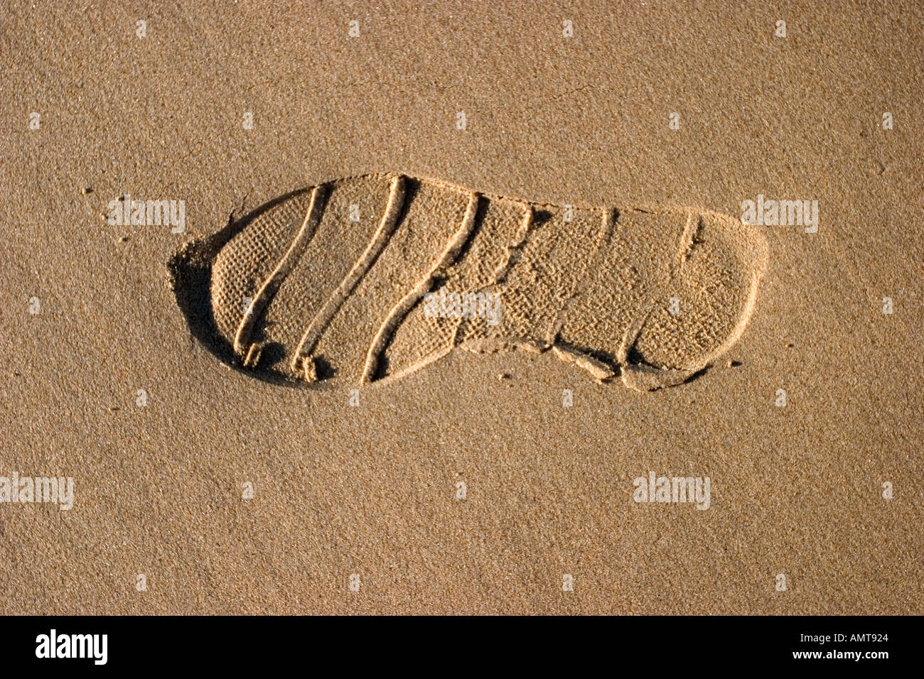 Footprints on sandy beach Banque D'Images