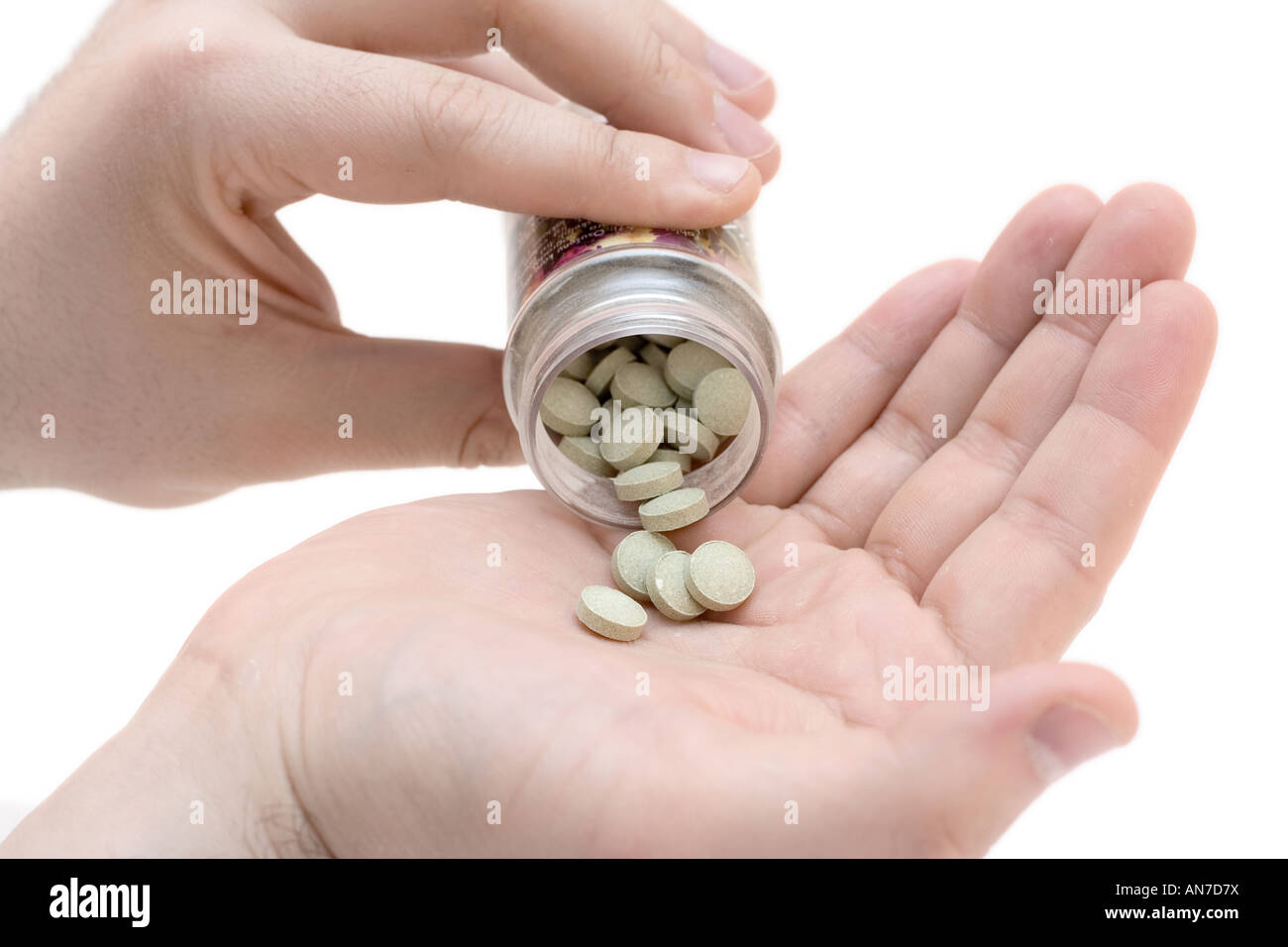 Hand holding pills Banque D'Images
