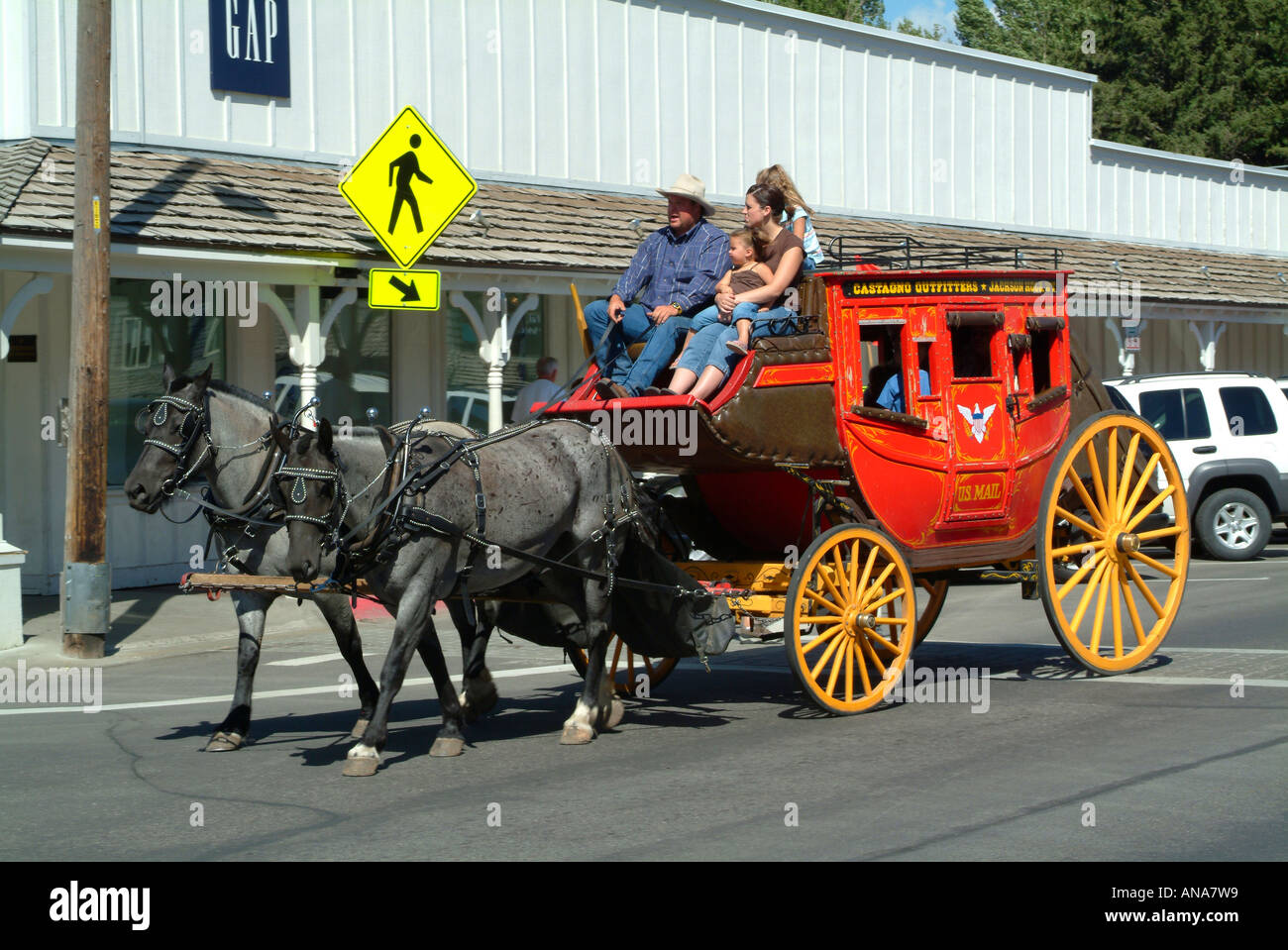 Stagecoach Cheval emmène les touristes dans les rues de Jackson Wyoming USA Banque D'Images