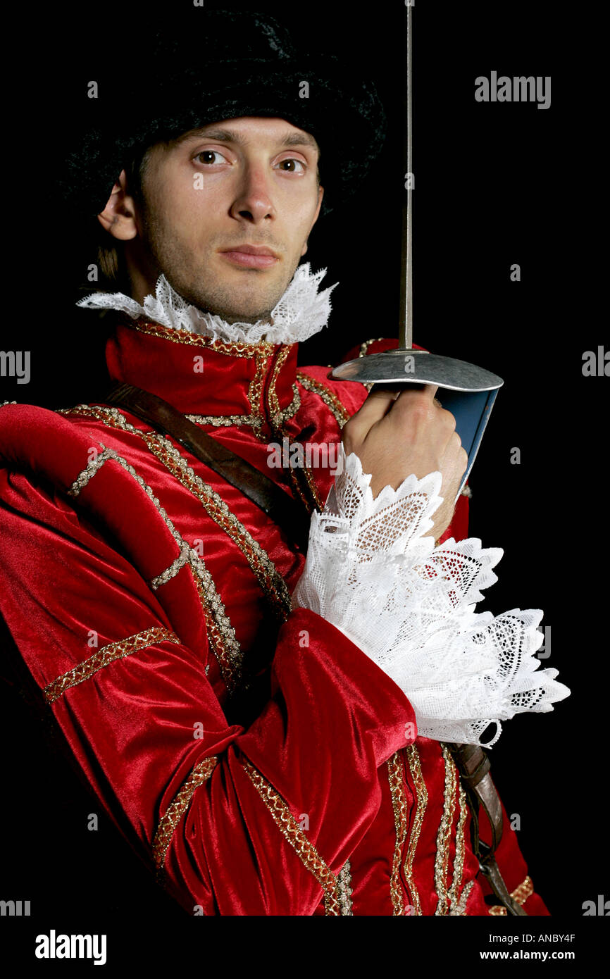 Comédien acteur costume couleur couleur rouge comédie Knight l'enfance d'épée rapière dumbfound face dumfounded fou rire gig Banque D'Images