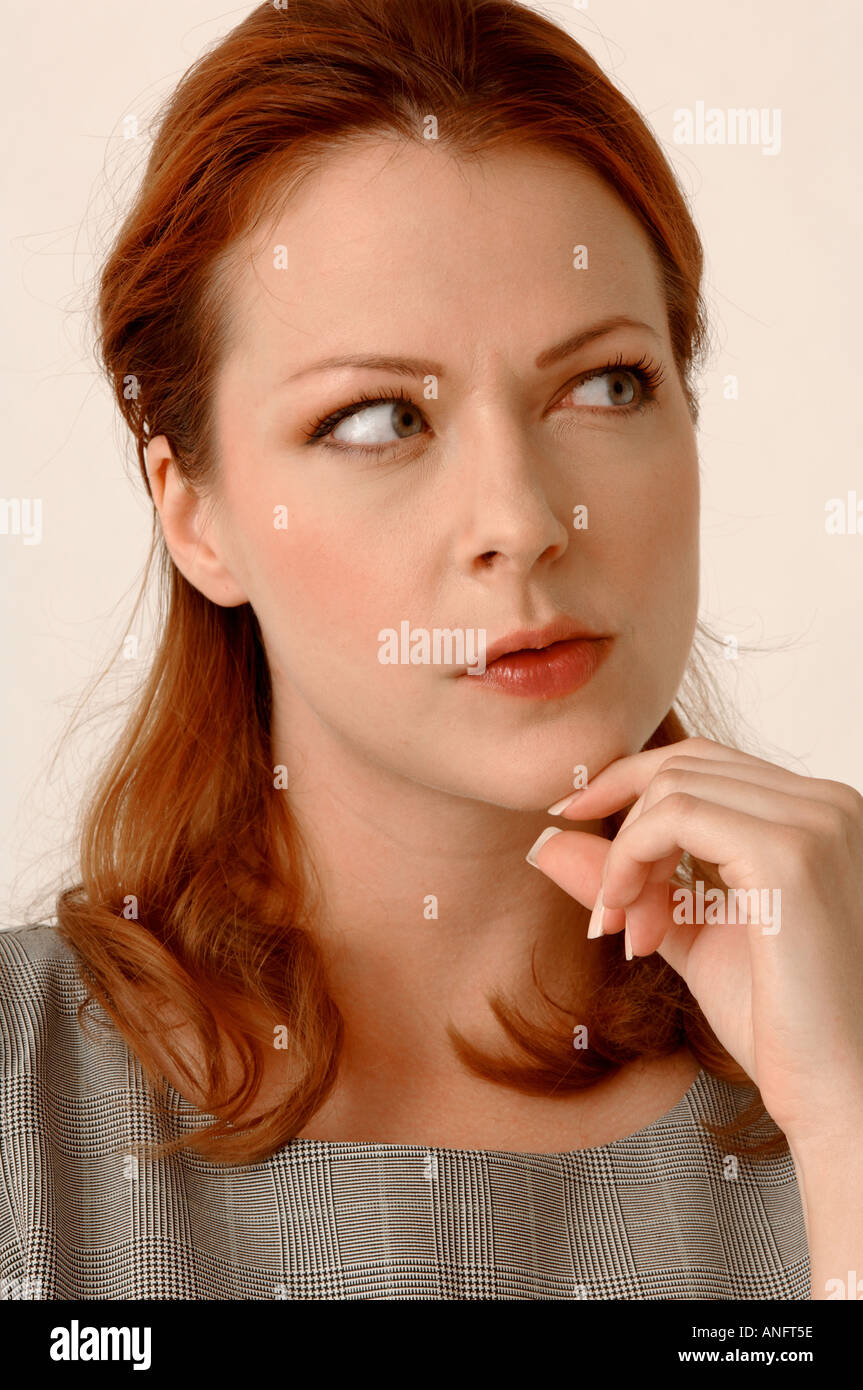 Close up portrait of an attractive woman thinking Banque D'Images