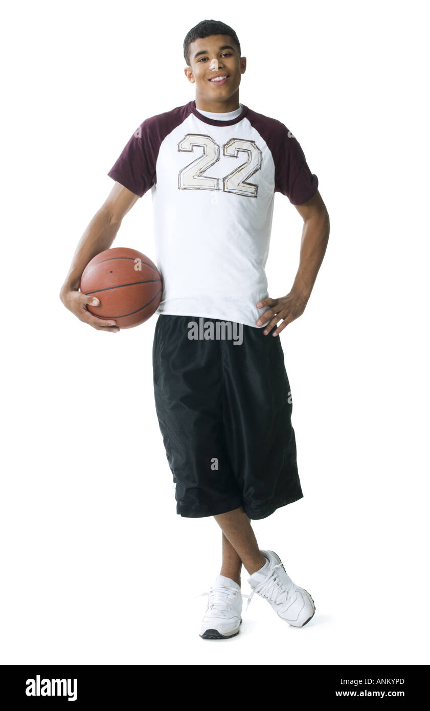 Portrait of a young man holding a basketball Banque D'Images