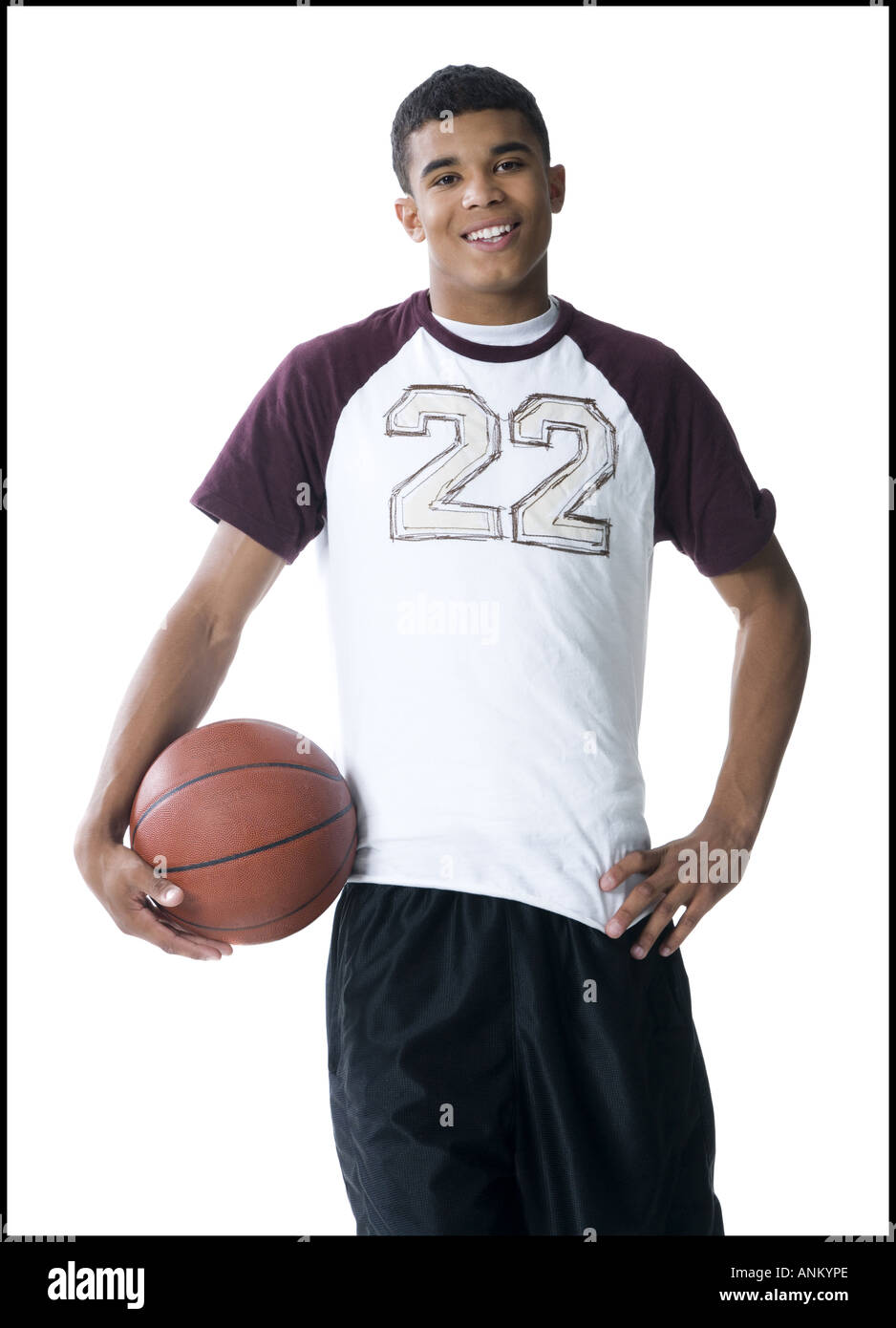 Portrait of a young man holding a basketball Banque D'Images