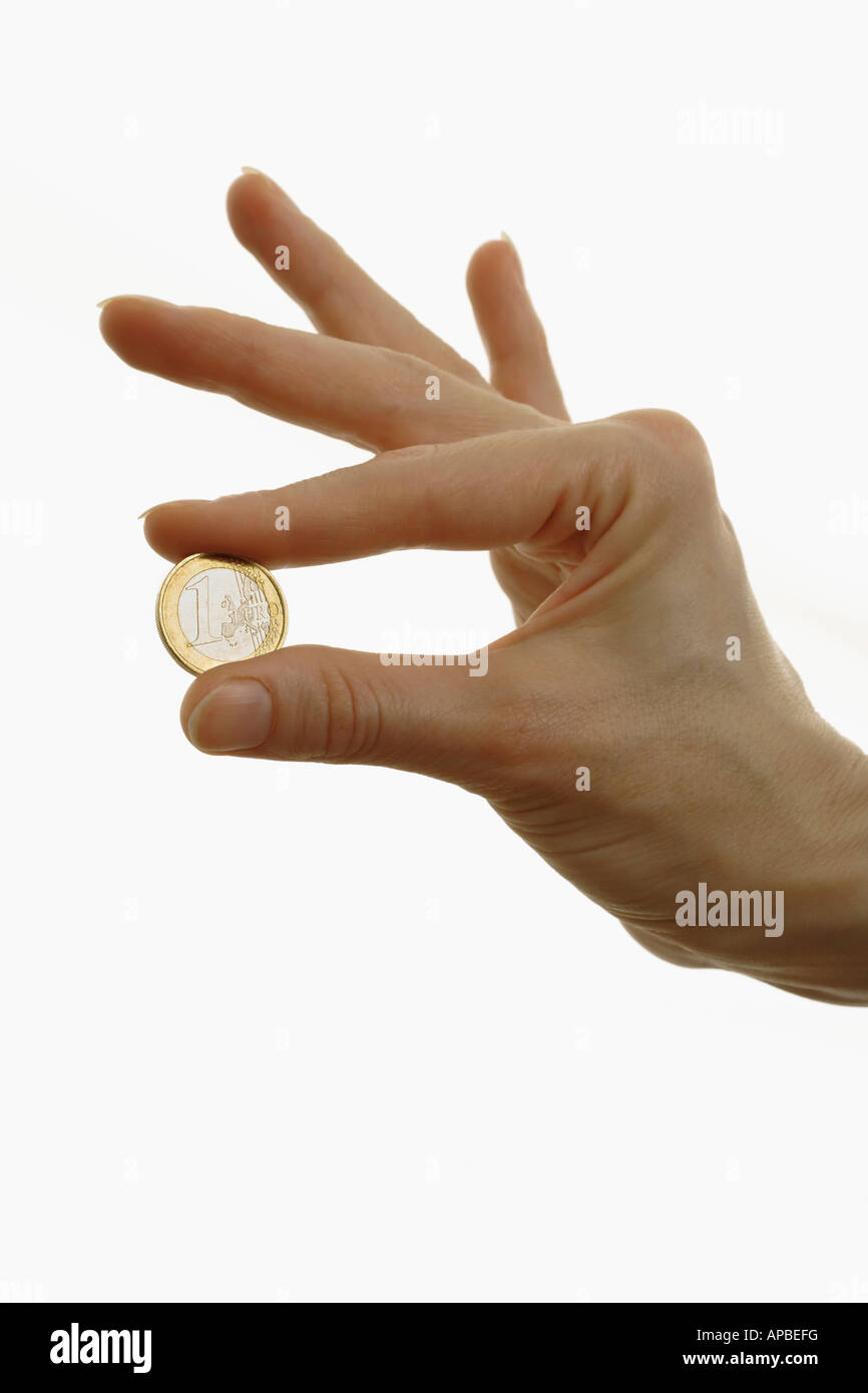 Main tenant une pièce de monnaie européenne euro argent Banque D'Images