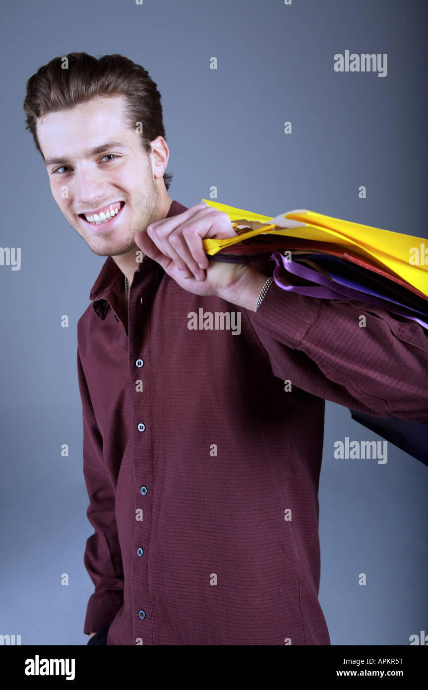 Young man with shopping bags Banque D'Images