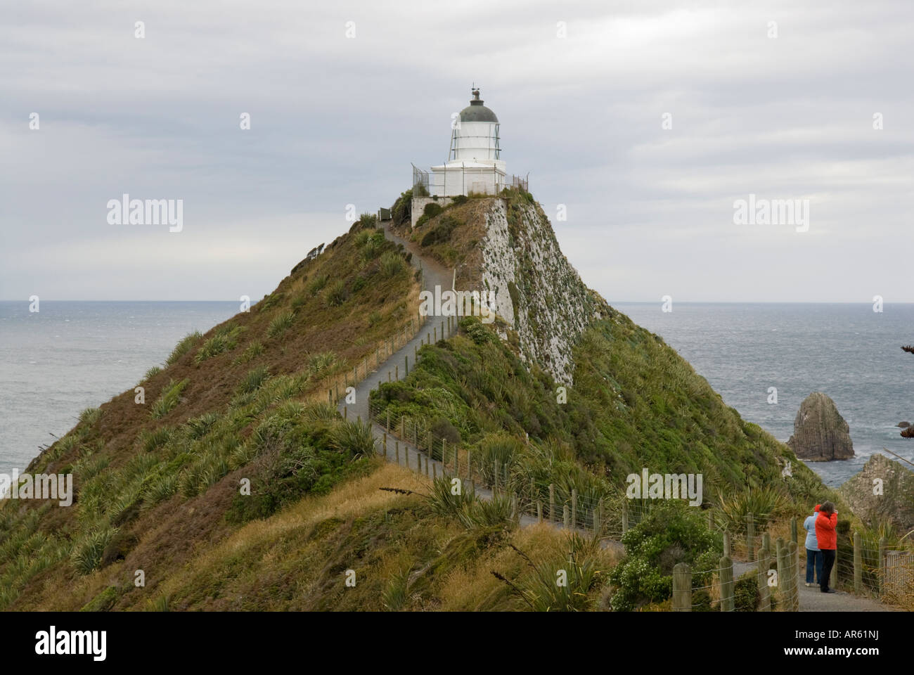 Les visiteurs du Nugget Point Lighthouse dans la région des Catlins Banque D'Images