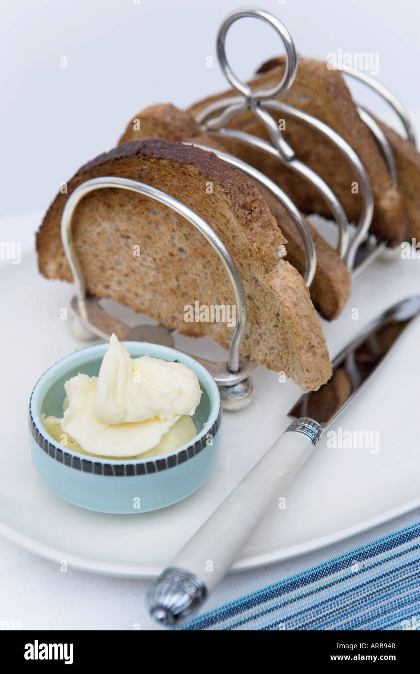 Rack complet avec Toast toast et beurre Banque D'Images