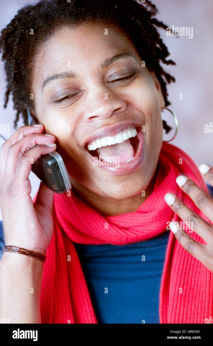 Portrait of African American woman on mobile phone Banque D'Images
