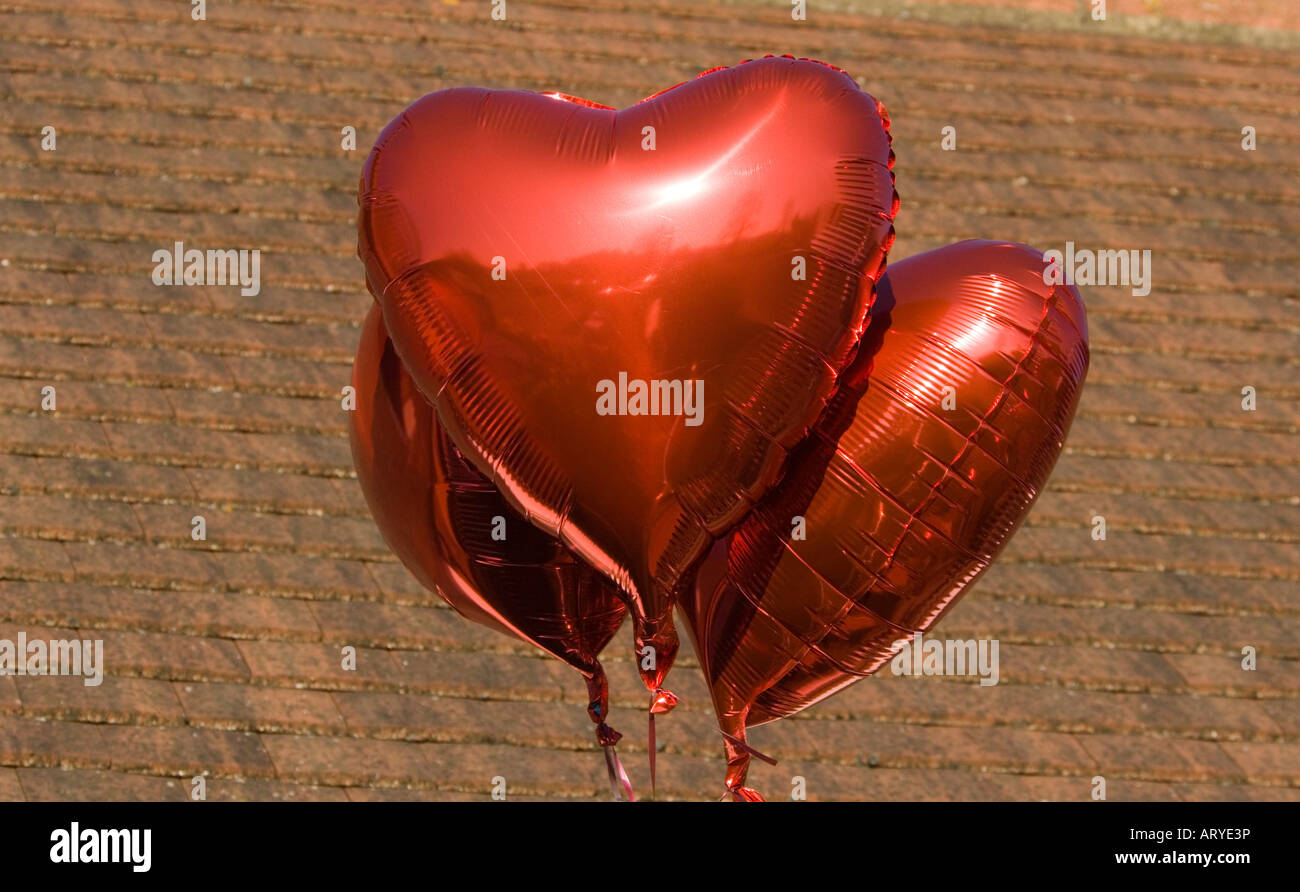 Trois ballons en forme de Cœur rouge Banque D'Images