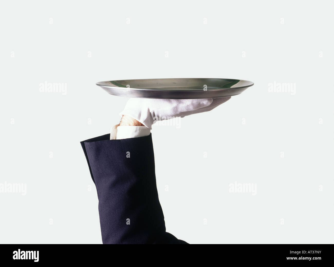 Un waiter holding a silver tray Banque D'Images