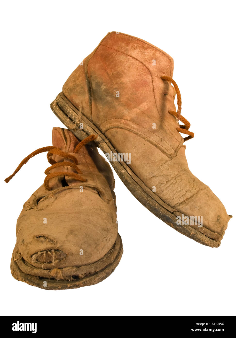 Vieux usé bottes de travail avec des trous Banque D'Images