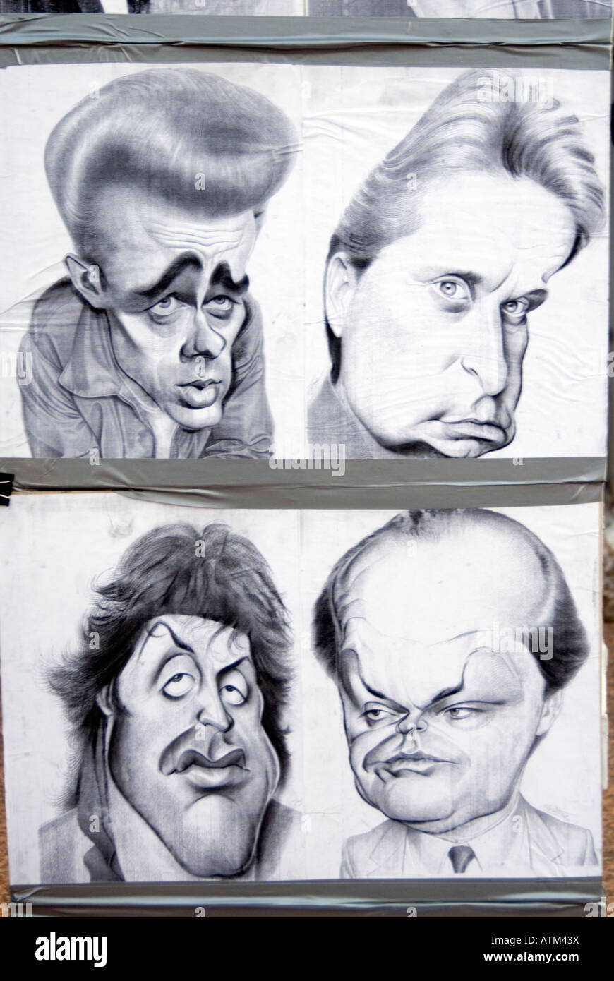 Caricatures de célèbres acteurs américains dessiné par Leicester Square Street London England UK artiste portrait Banque D'Images