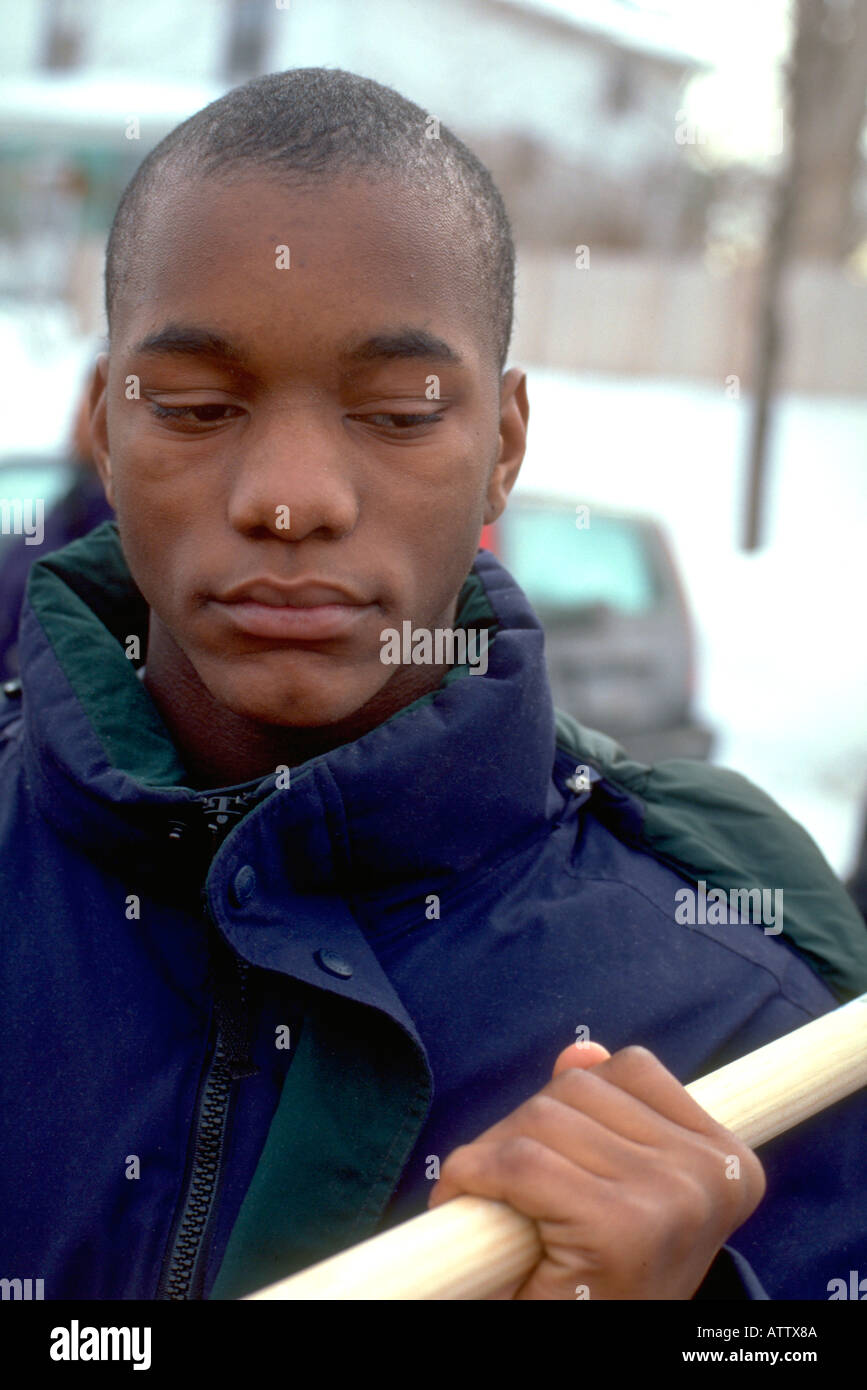 African American man age 20 marching in Martin Luther King Day mars. St Paul Minnesota USA Banque D'Images