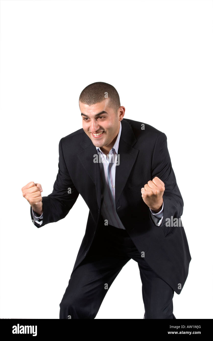 Excité et heureux business man smiling raising arms Banque D'Images