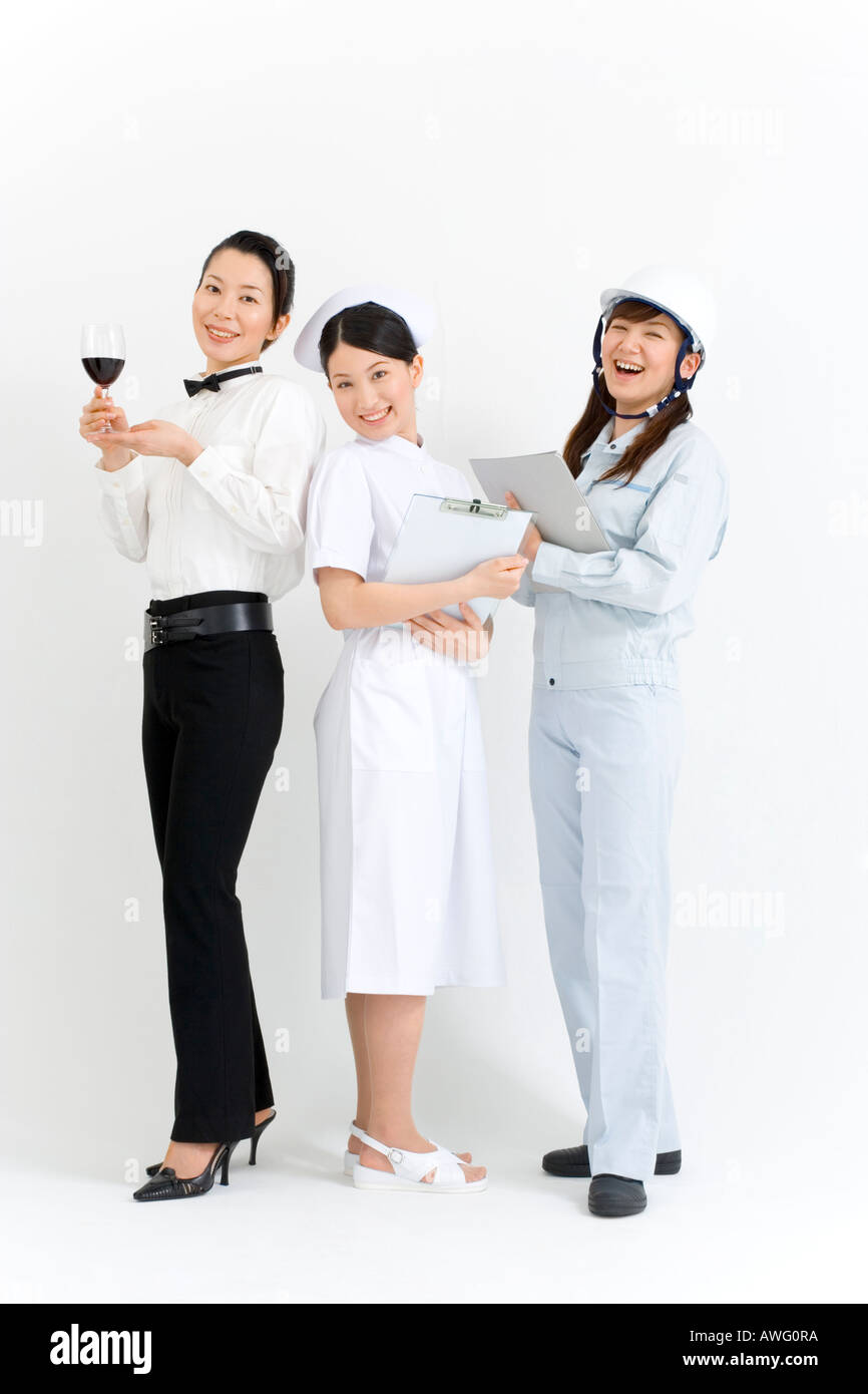 Trois jeunes femmes en uniforme professionnel Banque D'Images