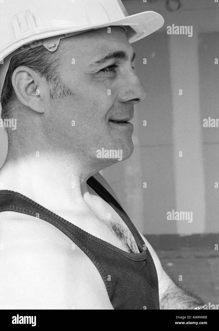 Construction Worker wearing hard hat, side view, b&w Banque D'Images