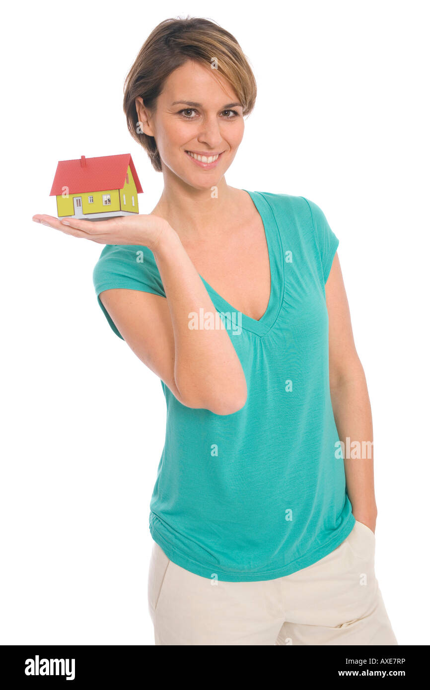 Woman holding house Banque D'Images