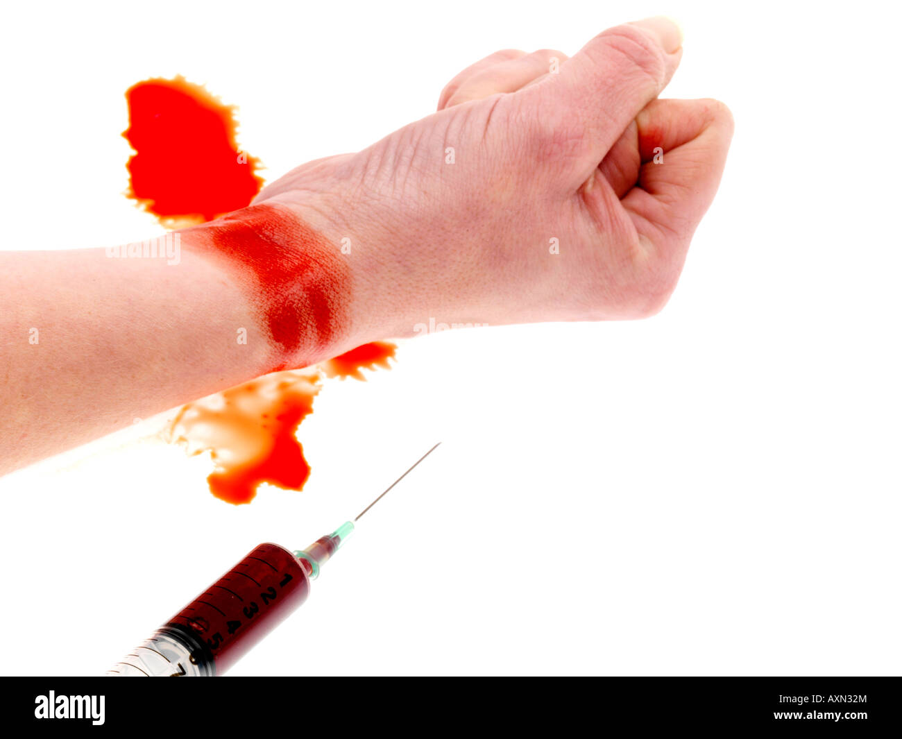 Seringue et poignet Banque D'Images