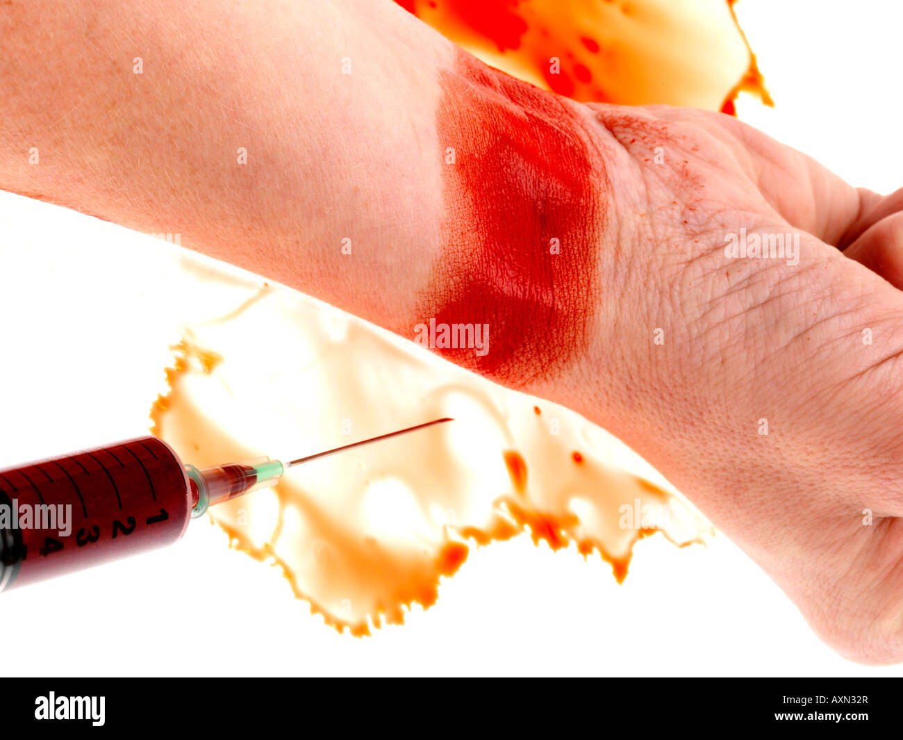 Seringue et poignet Banque D'Images