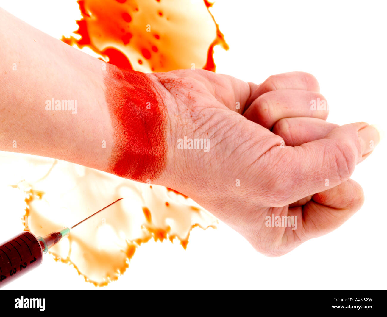 Seringue et poignet Banque D'Images