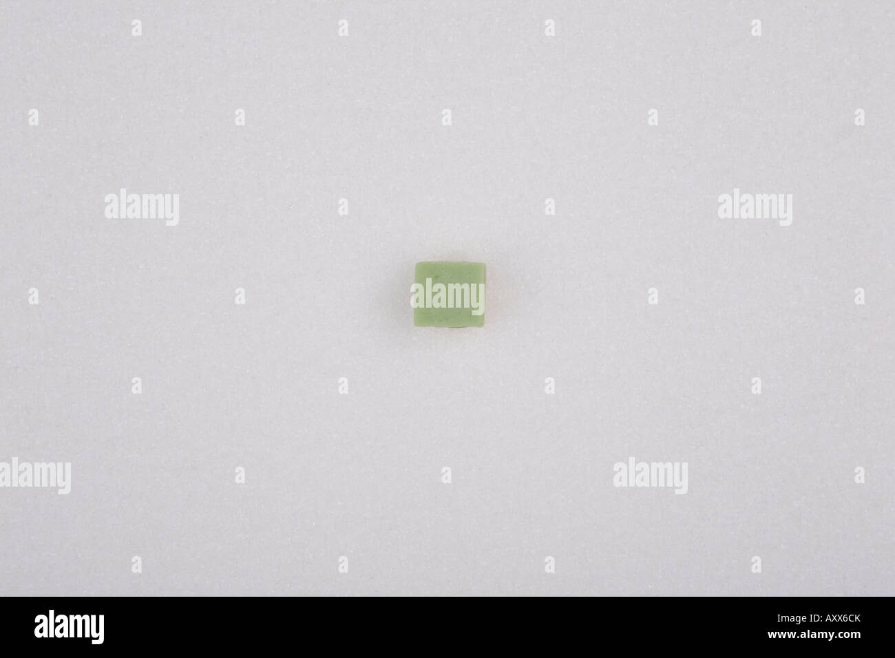 Un morceau de candy sur fond de sucre Banque D'Images