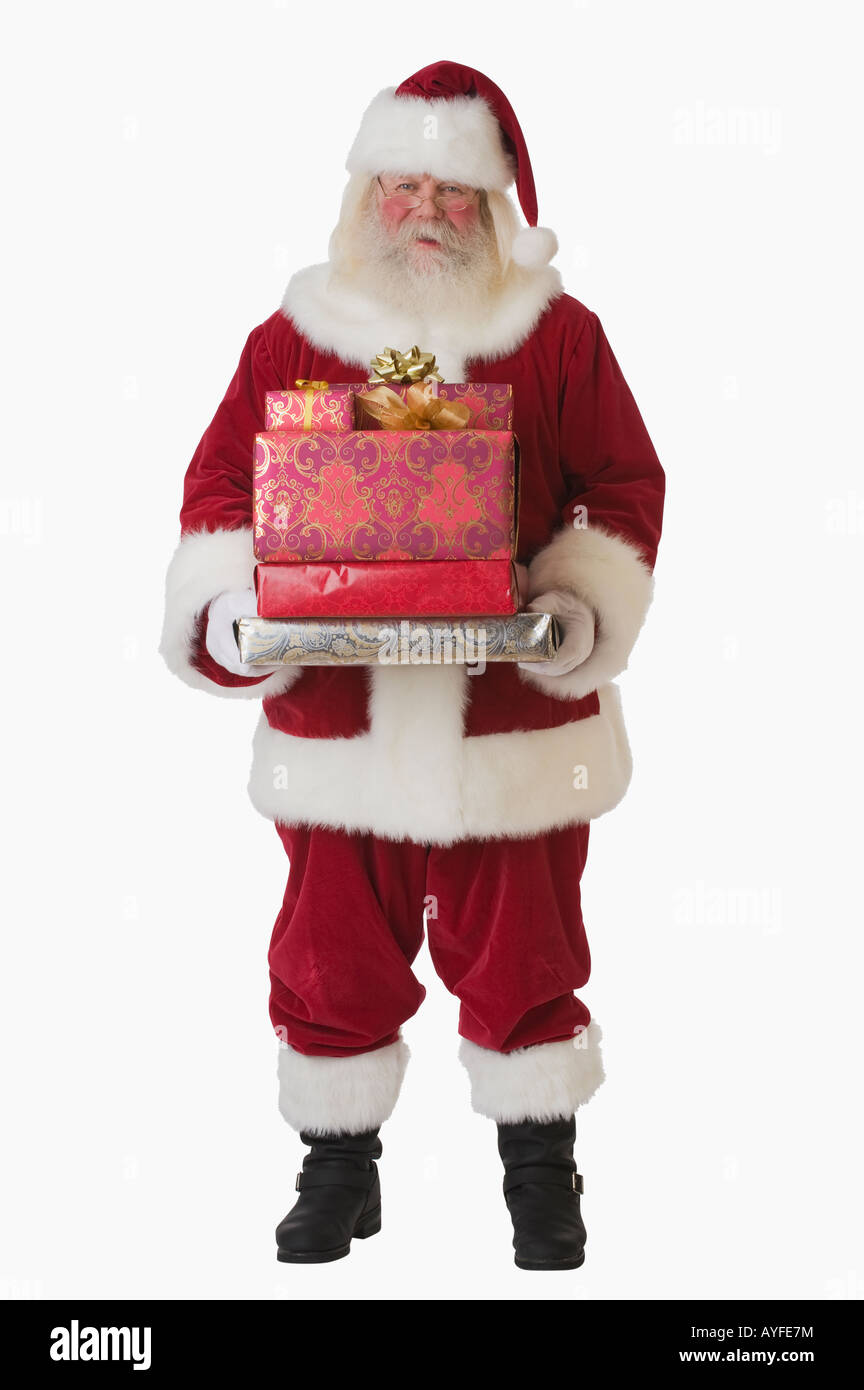 Santa Claus holding pile de cadeaux Banque D'Images