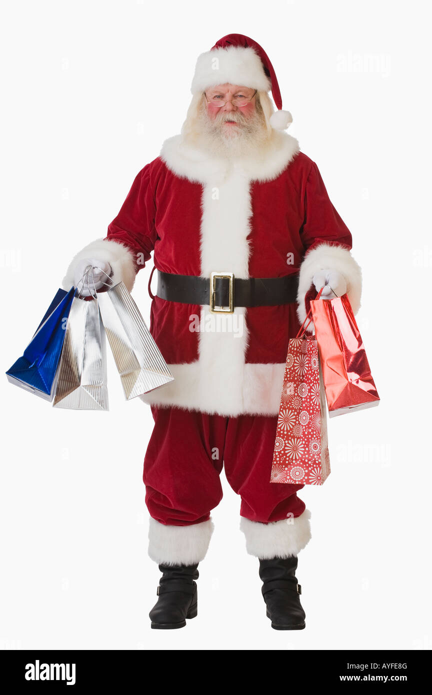 Santa Claus holding shopping bags Banque D'Images