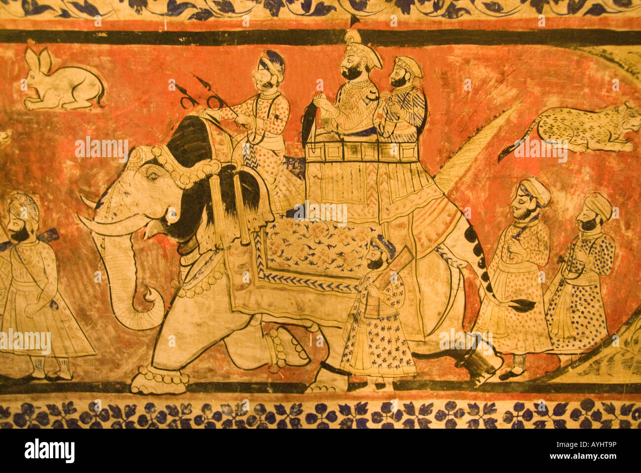 Carreau de mur antique représentant un maharajah sur un éléphant avec son entourage sur une expédition de chasse aux animaux. Banque D'Images