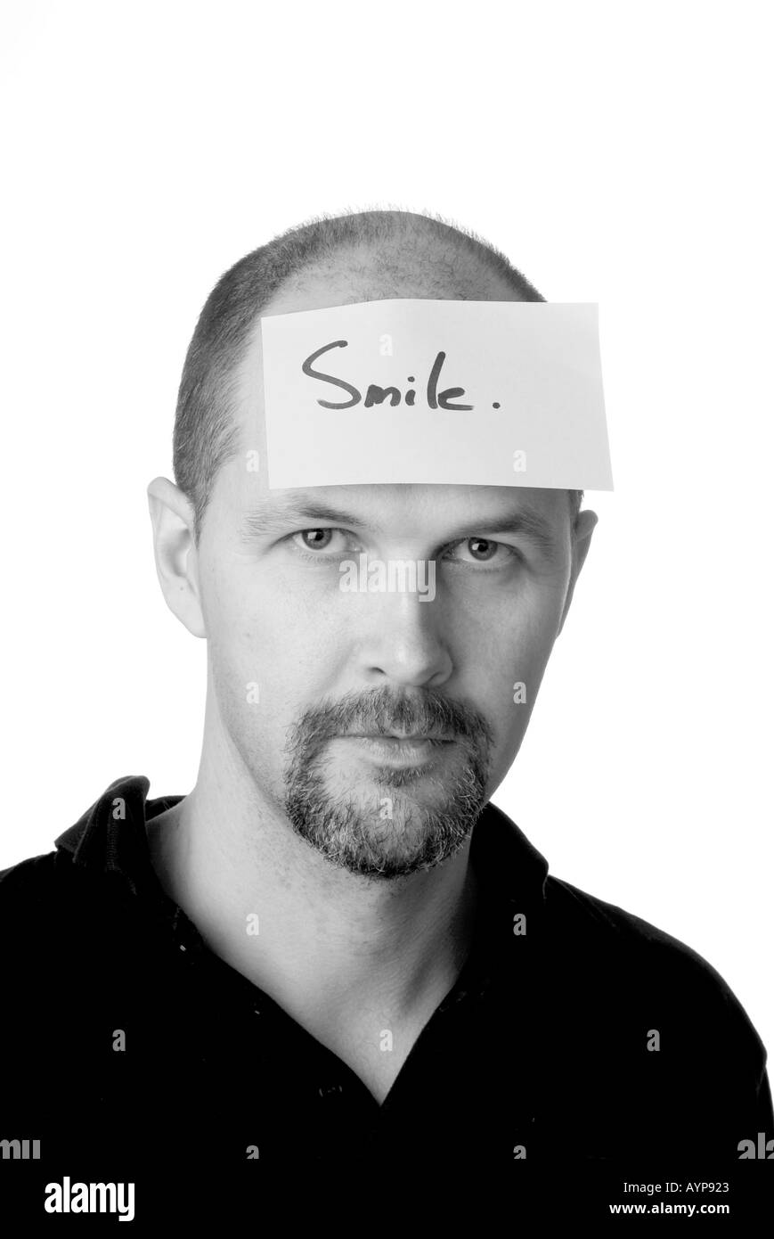 La pensée de l'humeur idée contempler dépression grognon sourire heureux cerveau expression du visage froncement des sourcils homme goatie beard moody feelin Banque D'Images