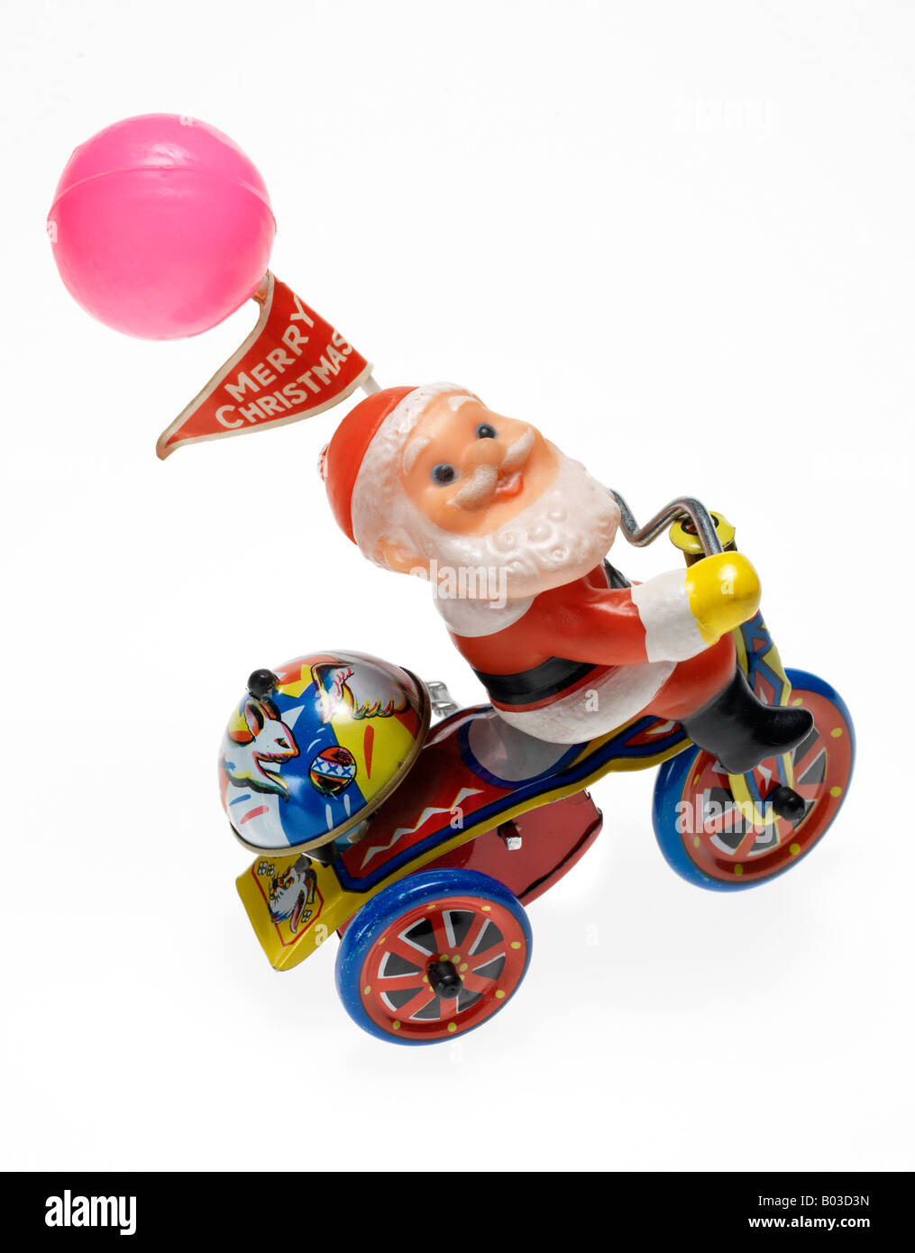 Santa Claus metal wind up jouet sur fond blanc Banque D'Images