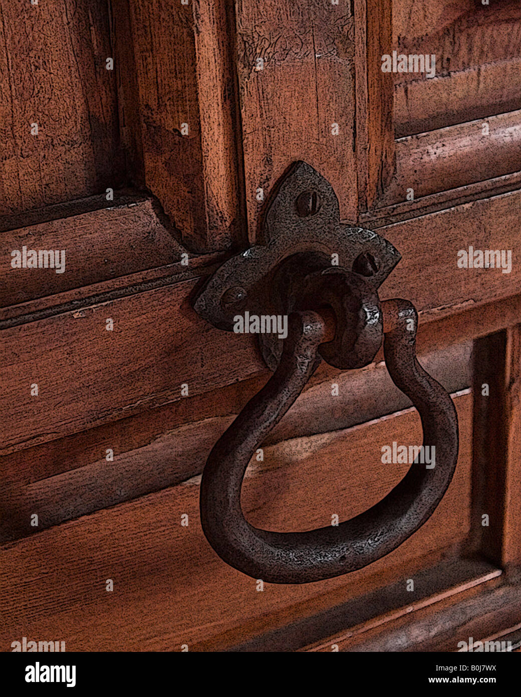Poignée de porte en fer vieilli sur soulevées porte en chêne Banque D'Images