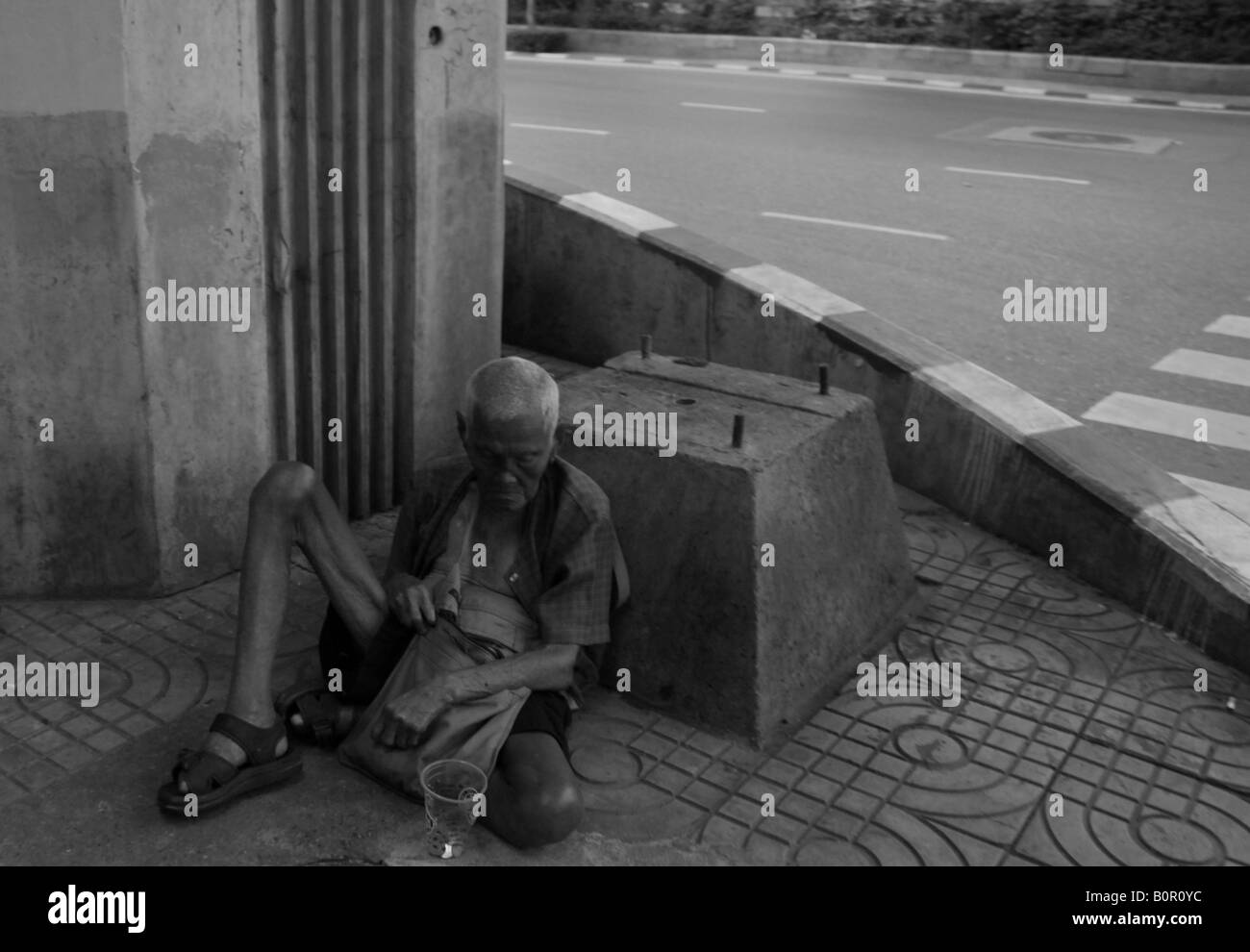 Vieux mendiant à Bangkok, Thaïlande Banque D'Images