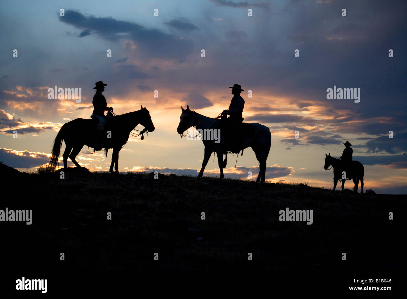 Trois pilotes au coucher du soleil, Wyoming Banque D'Images