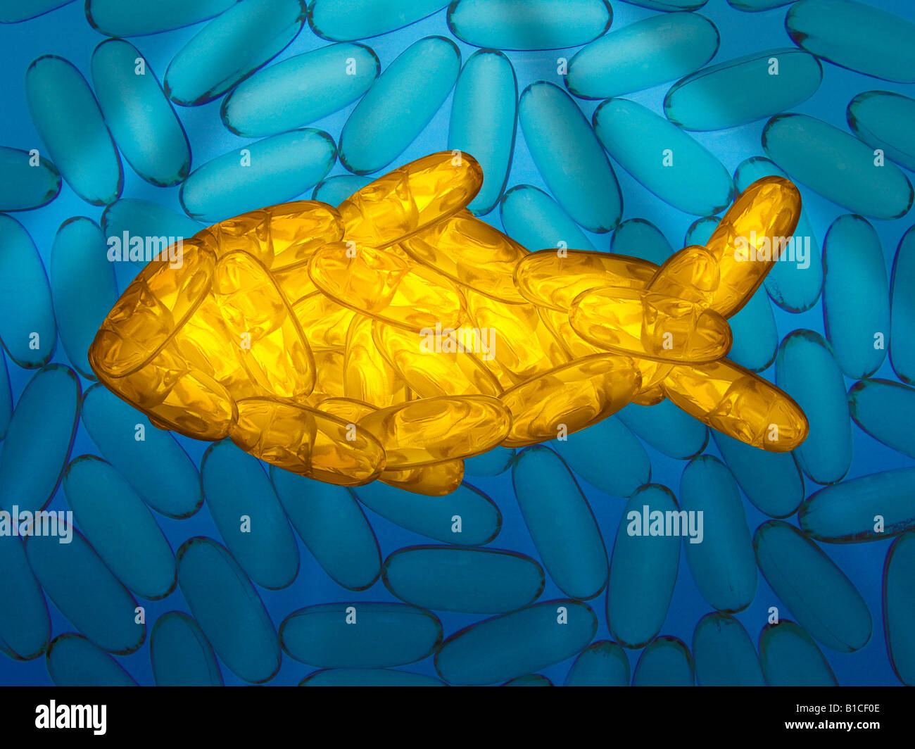 Des capsules d'huile de poisson formé dans la forme d'un poisson rouge dans l'eau avec le soleil au-dessus de streaming Banque D'Images