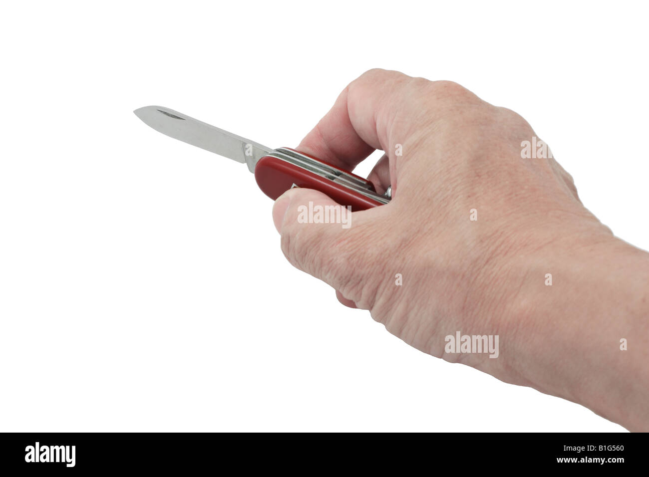 Hand holding red canif sur fond blanc Banque D'Images