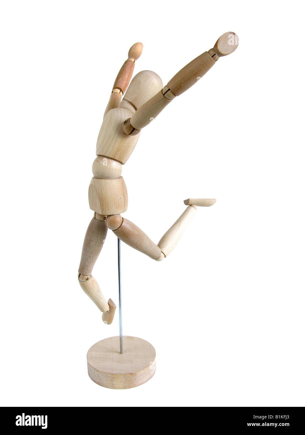Un modèle en bois miniature d'un humain en sautant de joie Banque D'Images