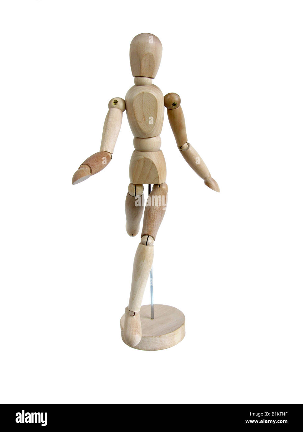 Un modèle en bois miniature d'un humain dans une exécution posent Banque D'Images