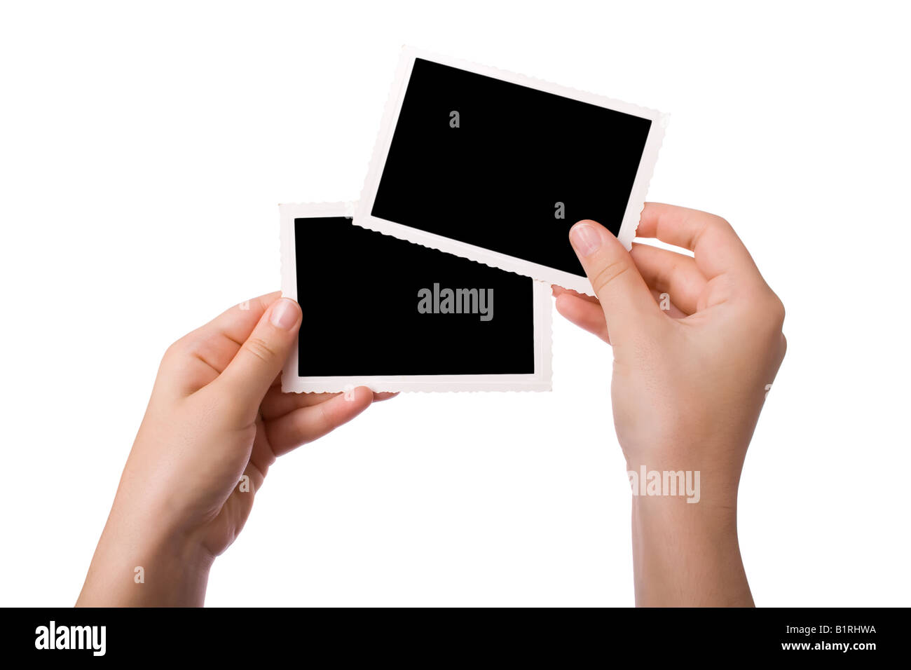 Mains tenant une photographie isolé sur fond blanc Banque D'Images