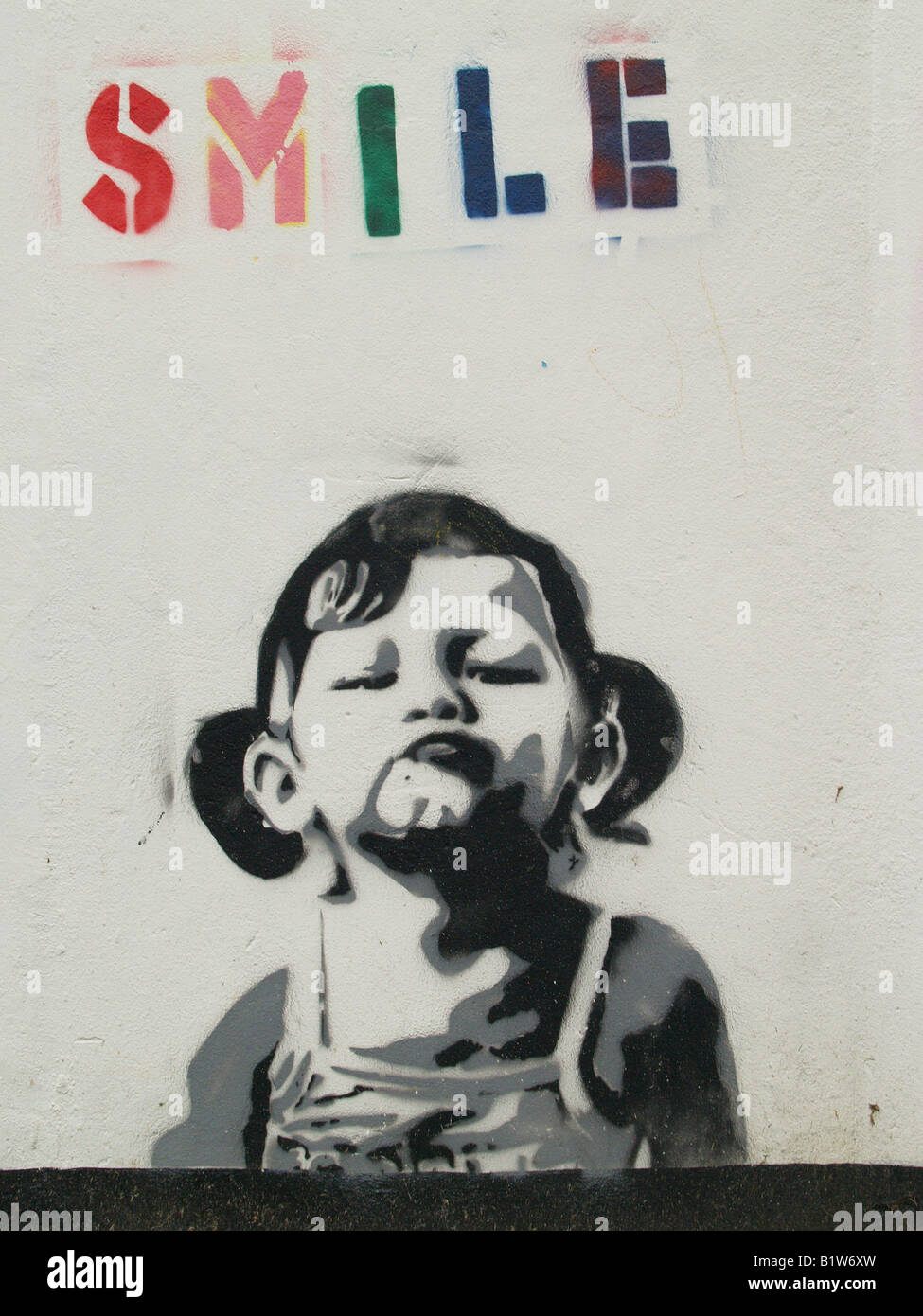 Graffiti pochoir Smile London UK Banque D'Images