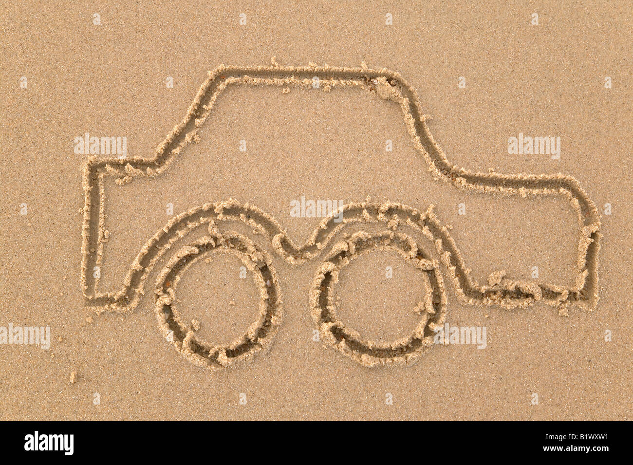 Dessin sur sable d'une voiture Banque D'Images