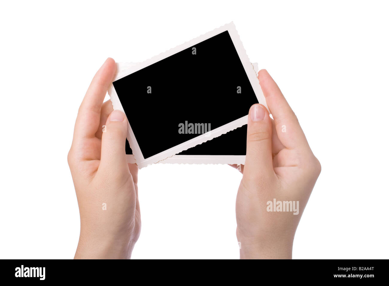 Mains tenant une photographie isolé sur fond blanc Banque D'Images