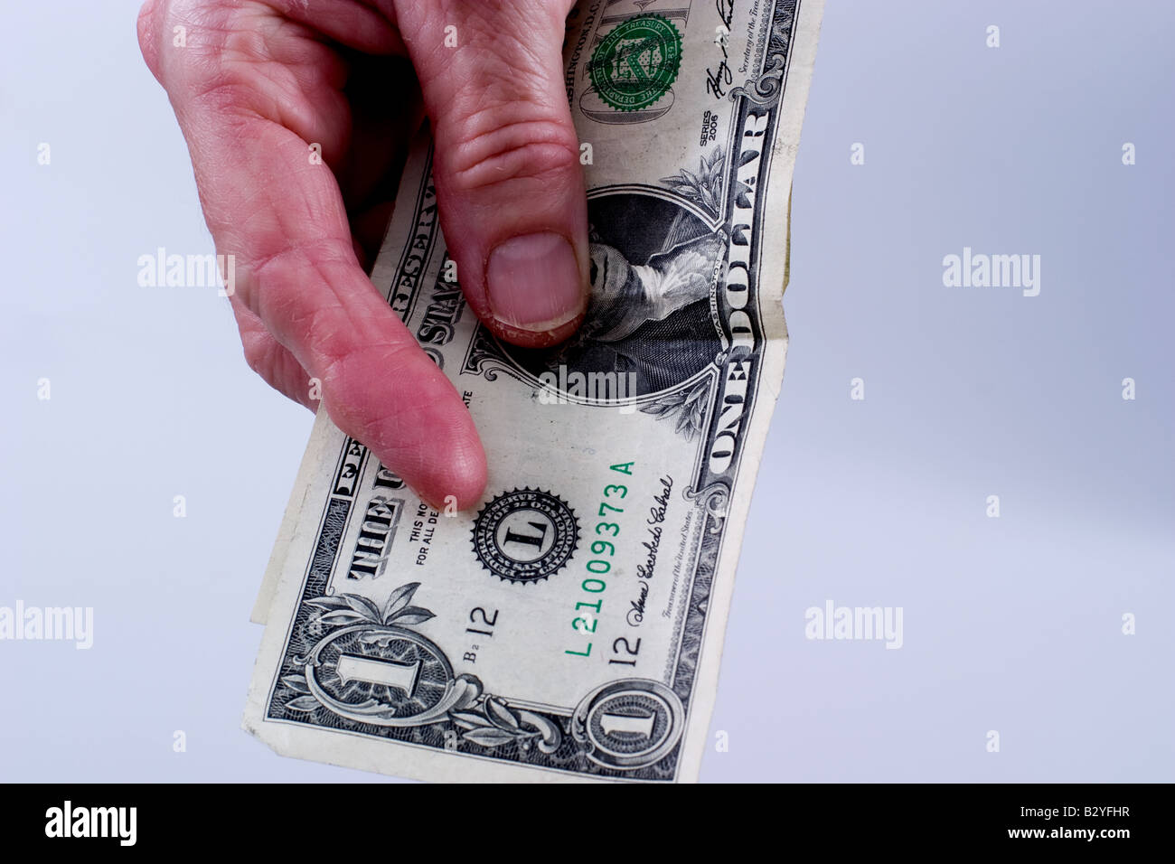 Woman holding an American dollar bill Banque D'Images