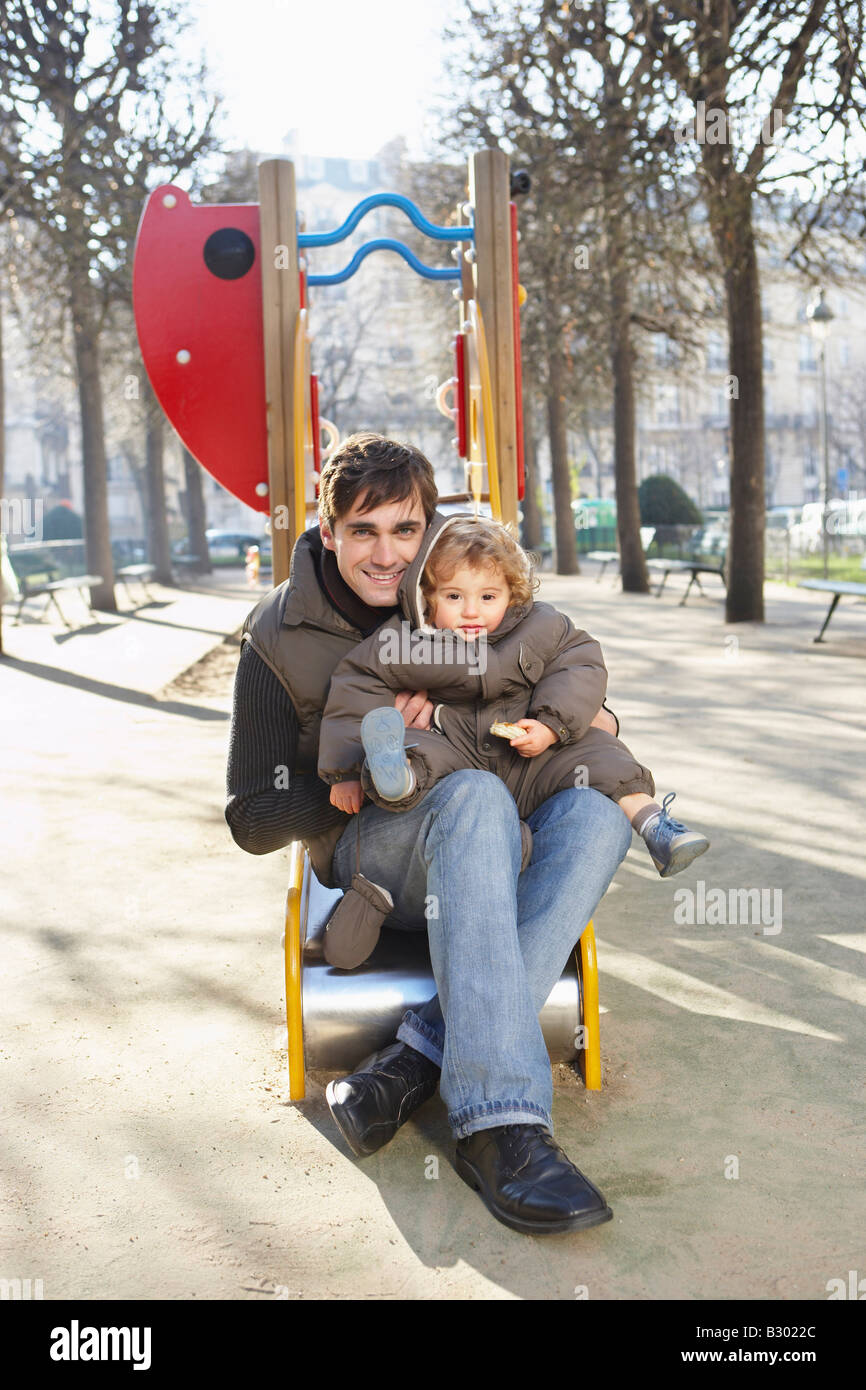 Pere Et Fils A L Aire De Jeux Paris France Photo Stock Alamy