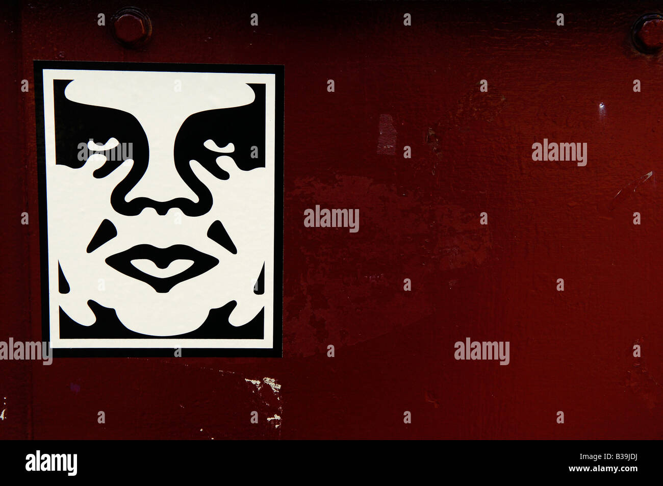 Conception Shepard Fairey obey giant american usa sticker art visage rouge illustration graphique Banque D'Images