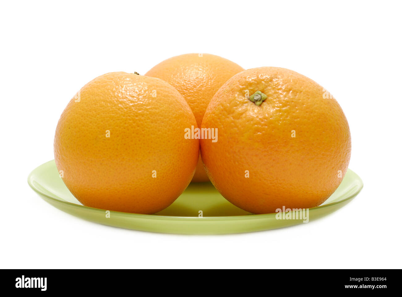 Les oranges sur une plaque Banque D'Images