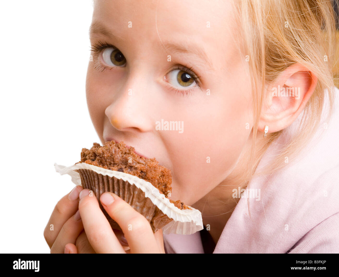 Girl eating muffin Photo Stock Alamy