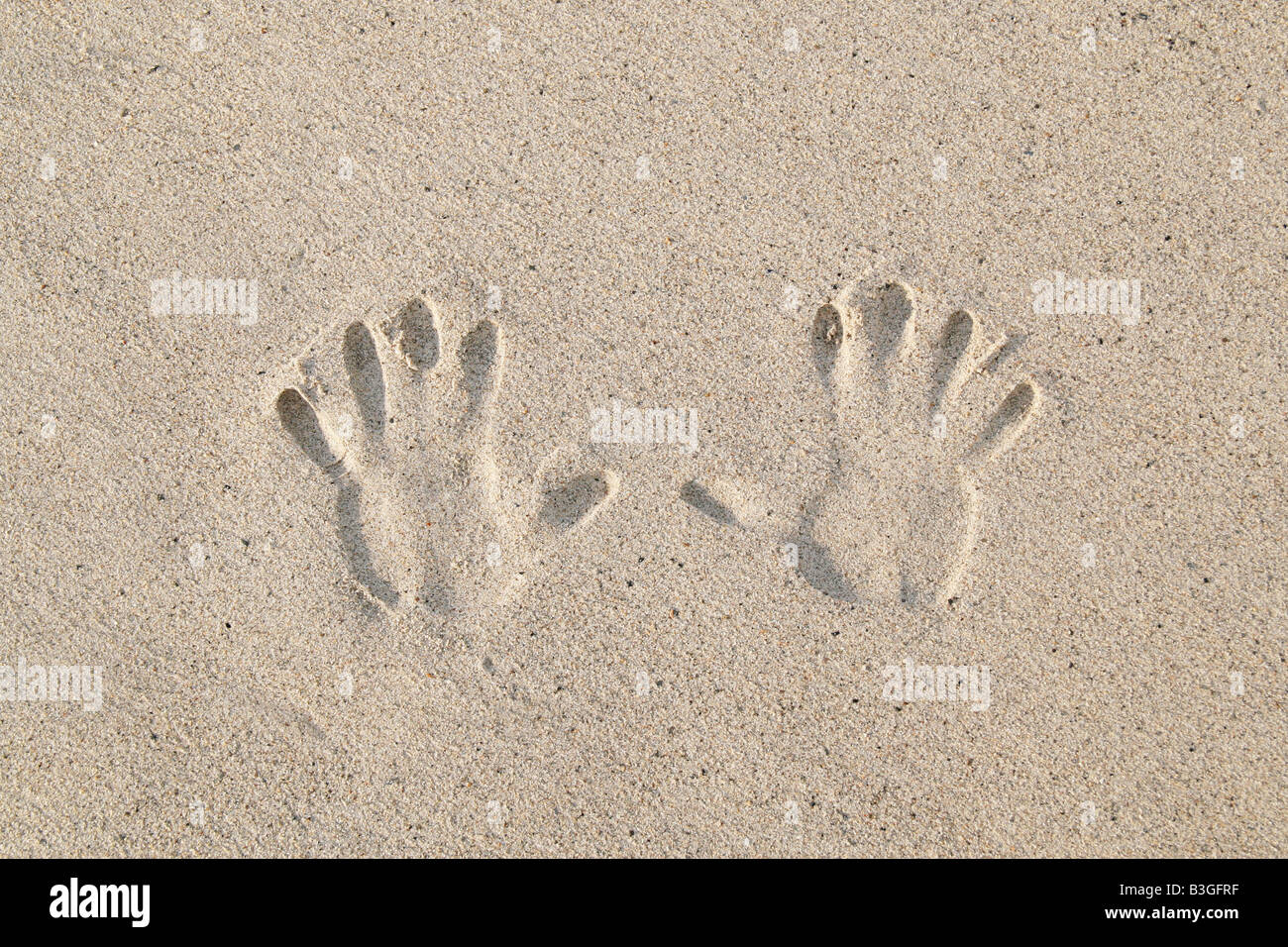 Imprime la main dans le sable Banque D'Images