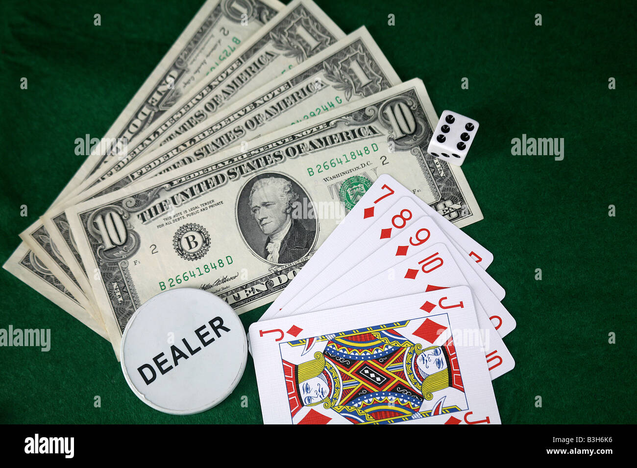 Jeu de carte avec des dollars américains de pari Banque D'Images