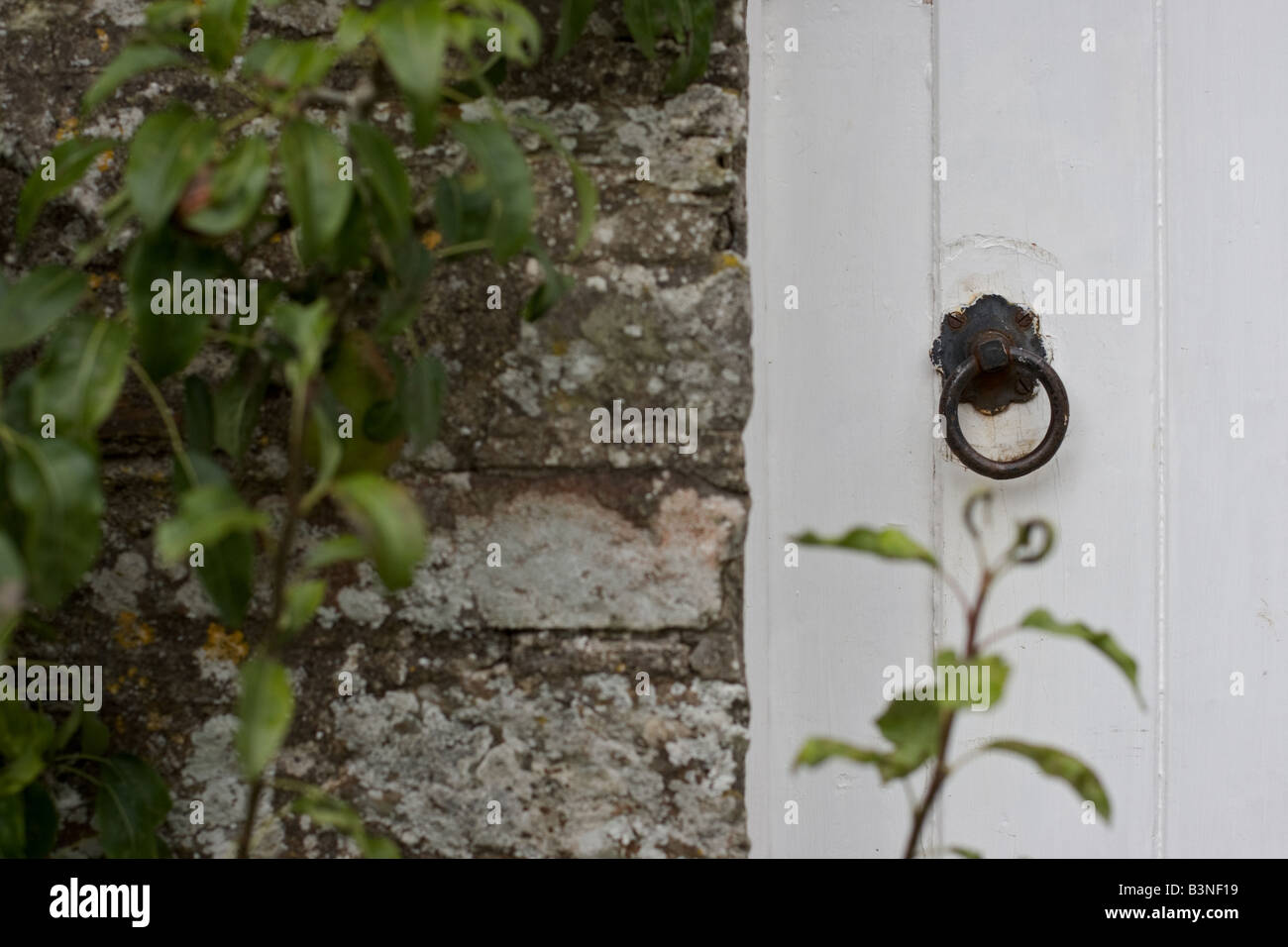 Maison de campagne dans la poignée de porte d'un édifice en pierre Banque D'Images